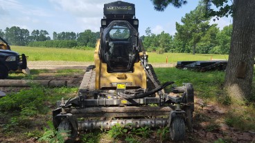compact track loader for tree removals, grading, driveway, and parking lot renovations, and ground preparations