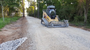 Bulldozer with road grading equipment