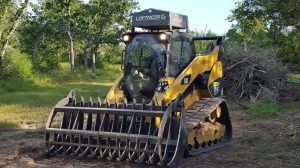 Compact track loader with heavy duty grapple