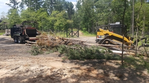 Land clearing equipment and tree chipper