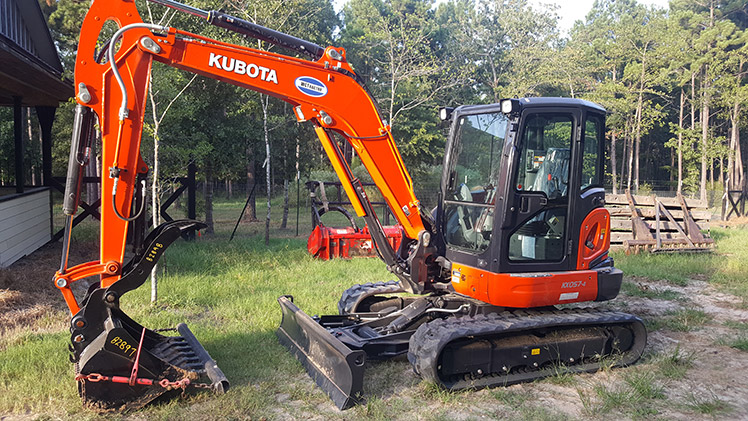 Kubota KX 057-4 excavator for trenching and tree removal