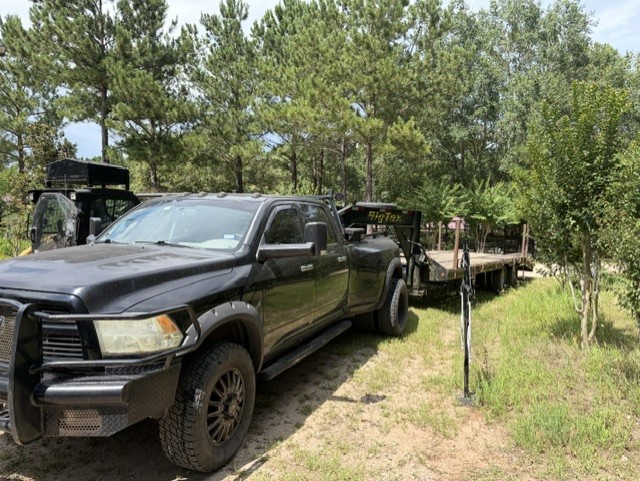 Dually truck and lowboy trailer equipment hauling Texas